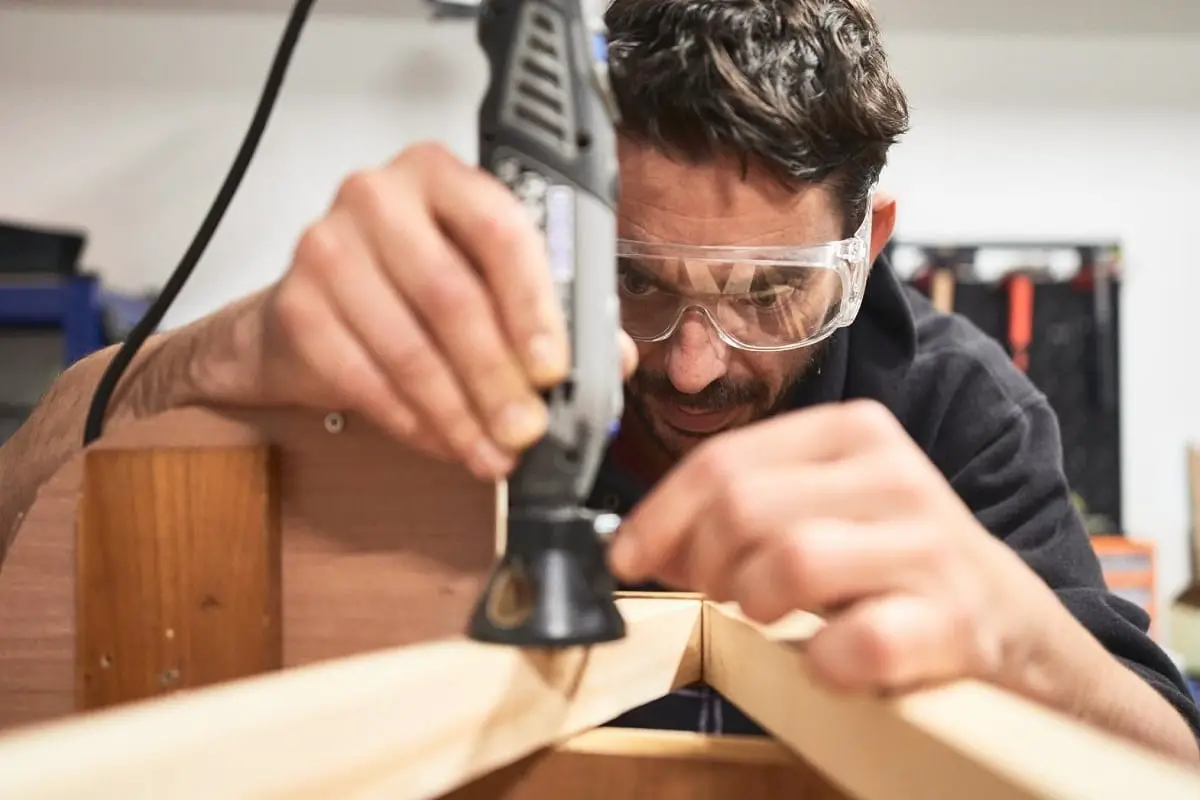 Man Using A Dremel