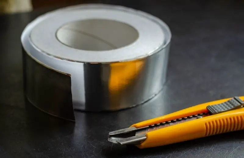 cutting aluminum tape with a box cutter