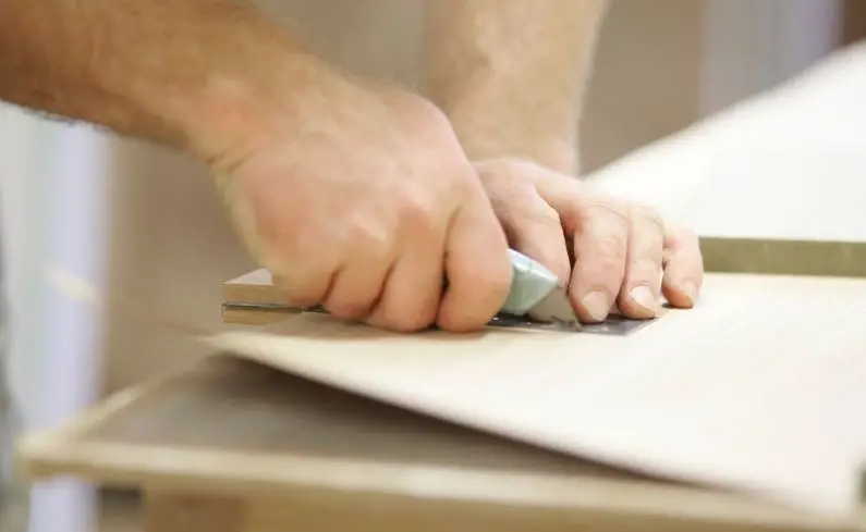 Cutting wood with a box cutter